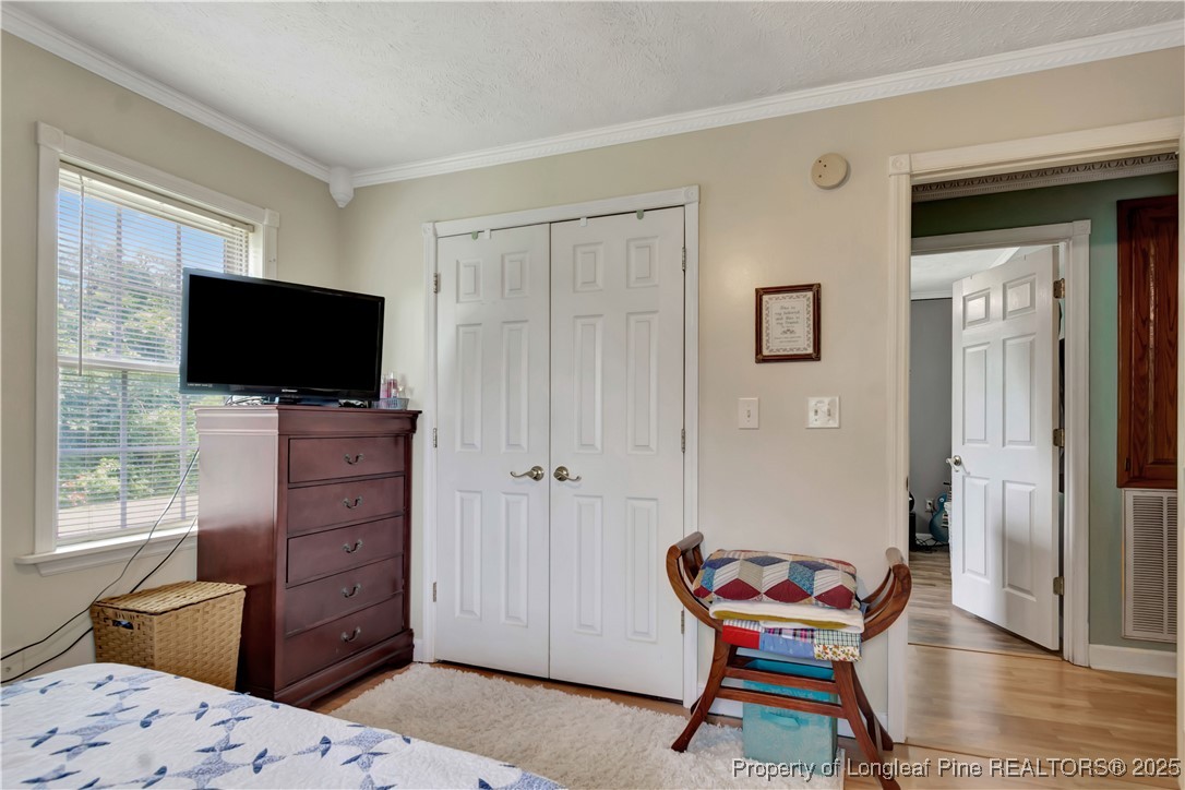 1079 Charlie Williamson Road Whiteville, NC 28472 - Photo 21 of 35 a bedroom with a bed and furniture