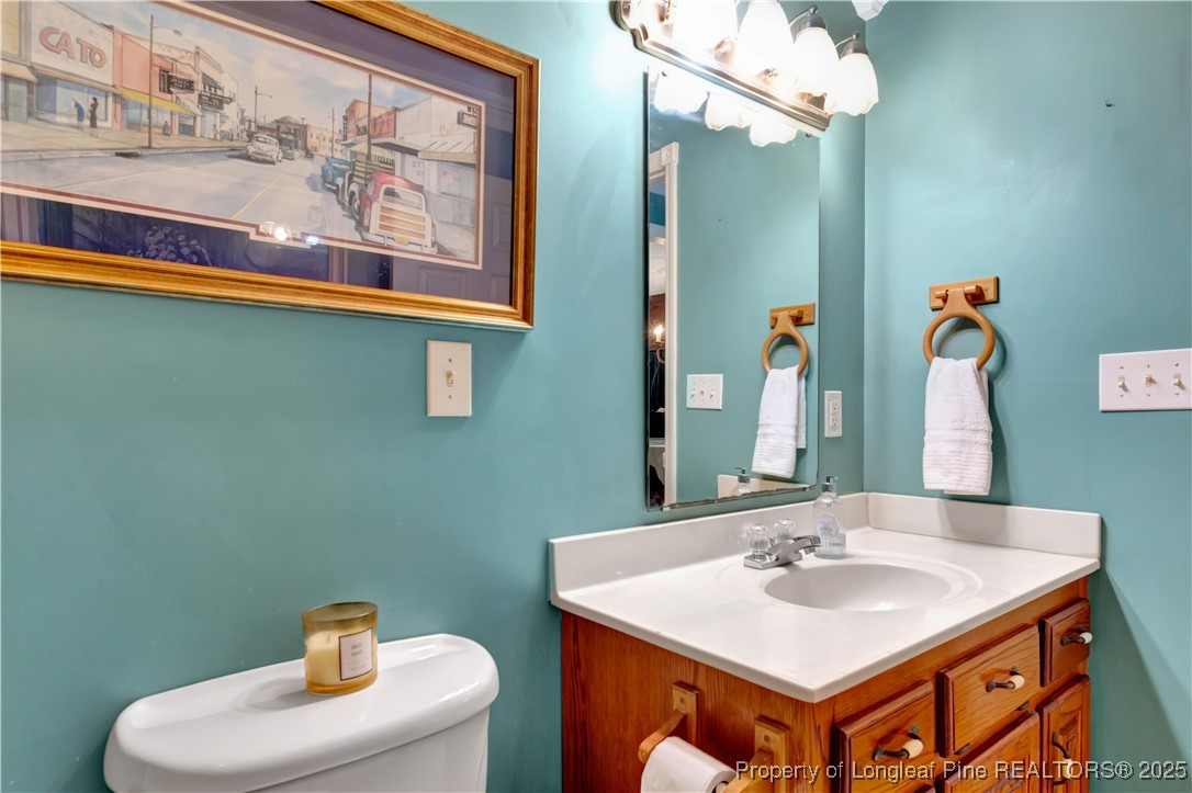 1079 Charlie Williamson Road Whiteville, NC 28472 - Photo 26 of 35 a bathroom with a sink and a mirror