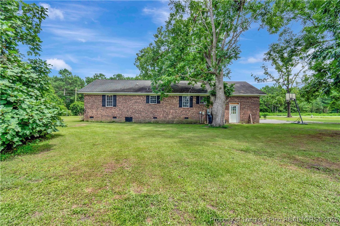 1079 Charlie Williamson Road Whiteville, NC 28472 - Photo 32 of 35 a front view of house with yard and green space