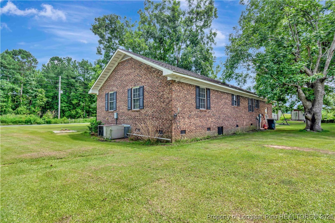 1079 Charlie Williamson Road Whiteville, NC 28472 - Photo 33 of 35 a front view of house with yard and green space