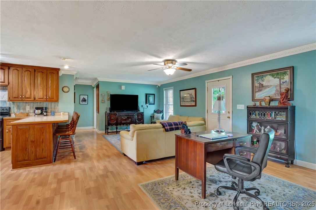 1079 Charlie Williamson Road Whiteville, NC 28472 - Photo 9 of 35 a living room with furniture and a flat screen tv