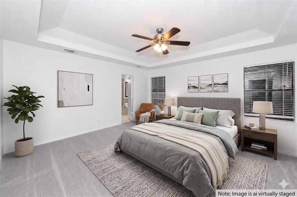 1001 Rosebud Drive Azle, TX 76020 - Photo 17 of 36 Spacious bedroom featuring light gray carpeting and white walls