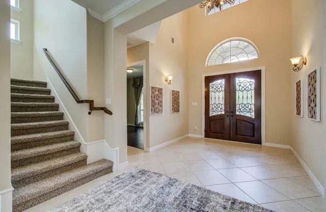 a view of a hallway view with wooden floor and staircase