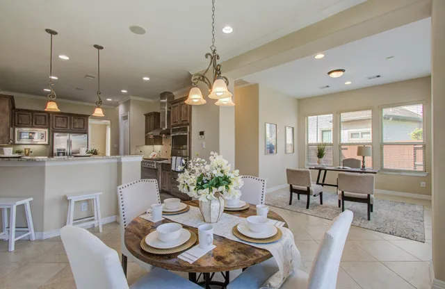 a dining room with furniture and window