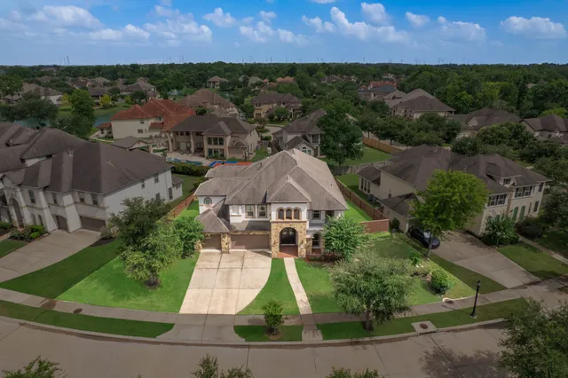 an aerial view of a house with a garden