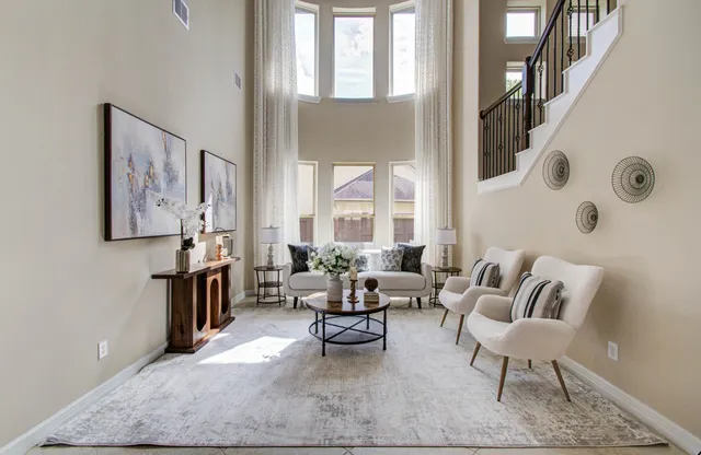a living room with furniture and a large window