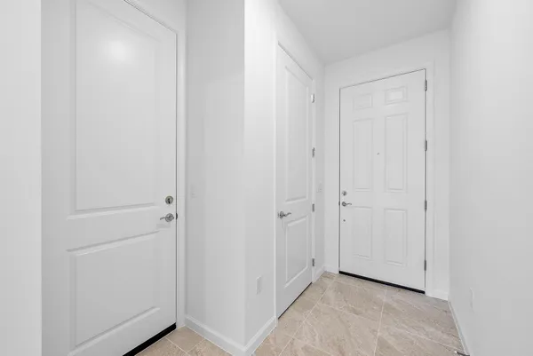 a view of hallway with closet