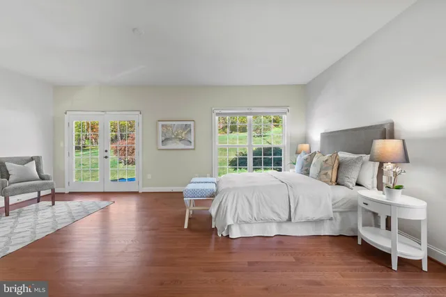 a bedroom with furniture and a window