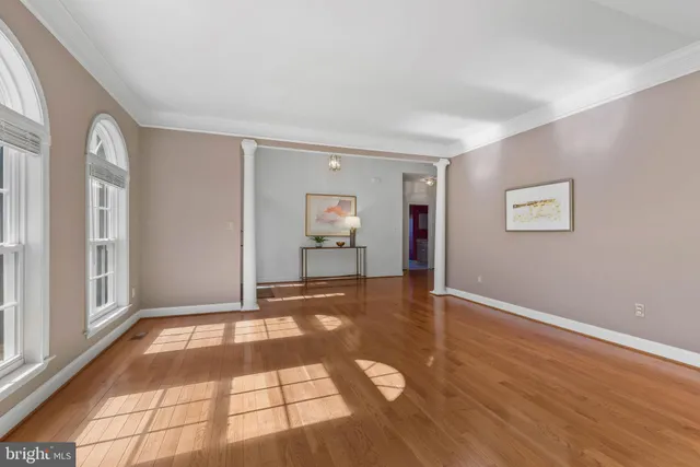 a view of an empty room with glass door