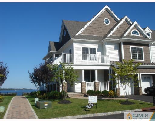 74 Raritan Reach Road South Amboy, NJ 08879 - Photo 1 of 8 front view of a house with a yard