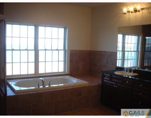 74 Raritan Reach Road South Amboy, NJ 08879 - Photo 4 of 8 a kitchen with a sink and a stove