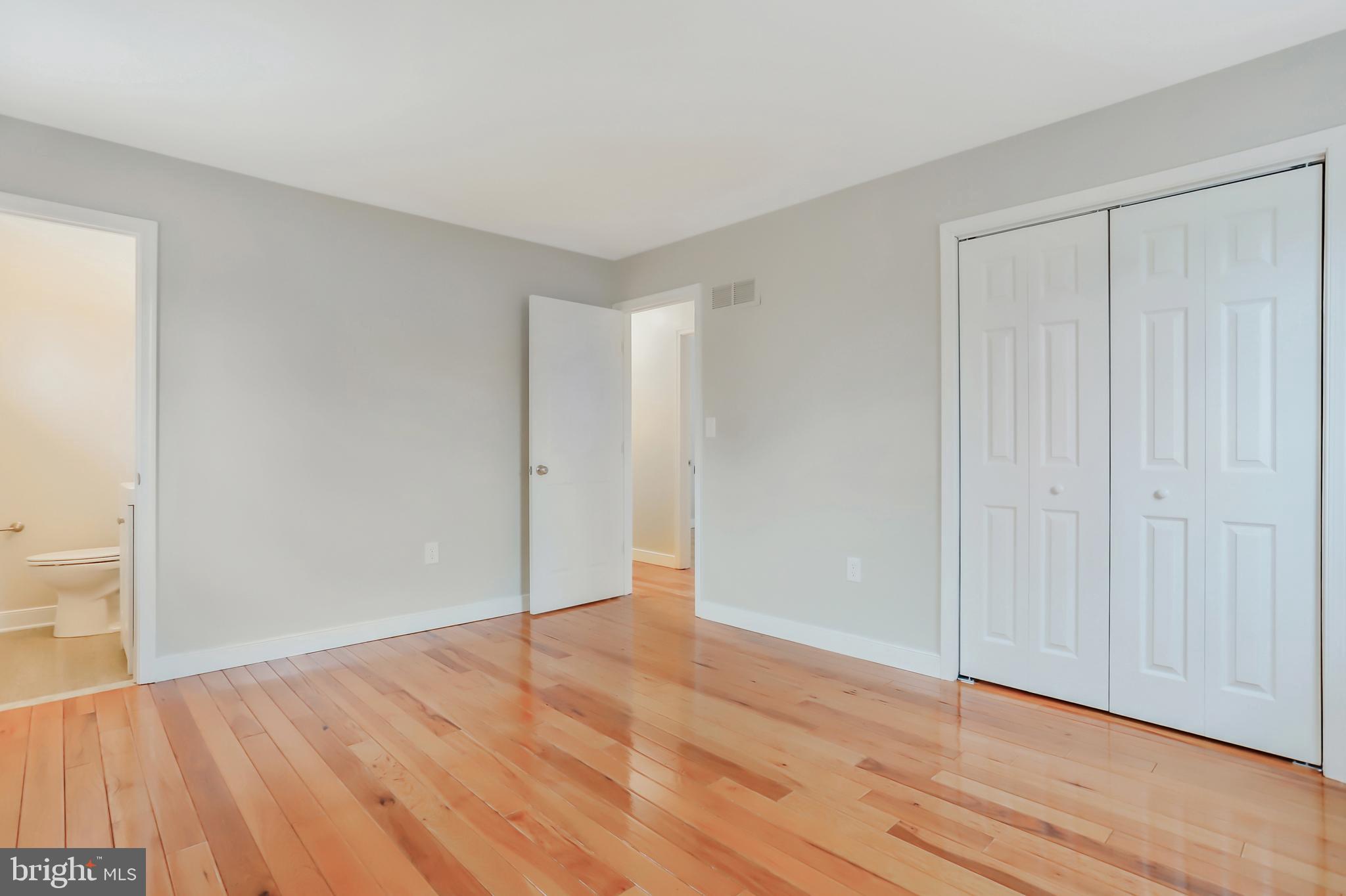 4355 Ridge Road Mount Airy, MD 21771 - Photo 31 of 54 a view of an empty room with wooden floor