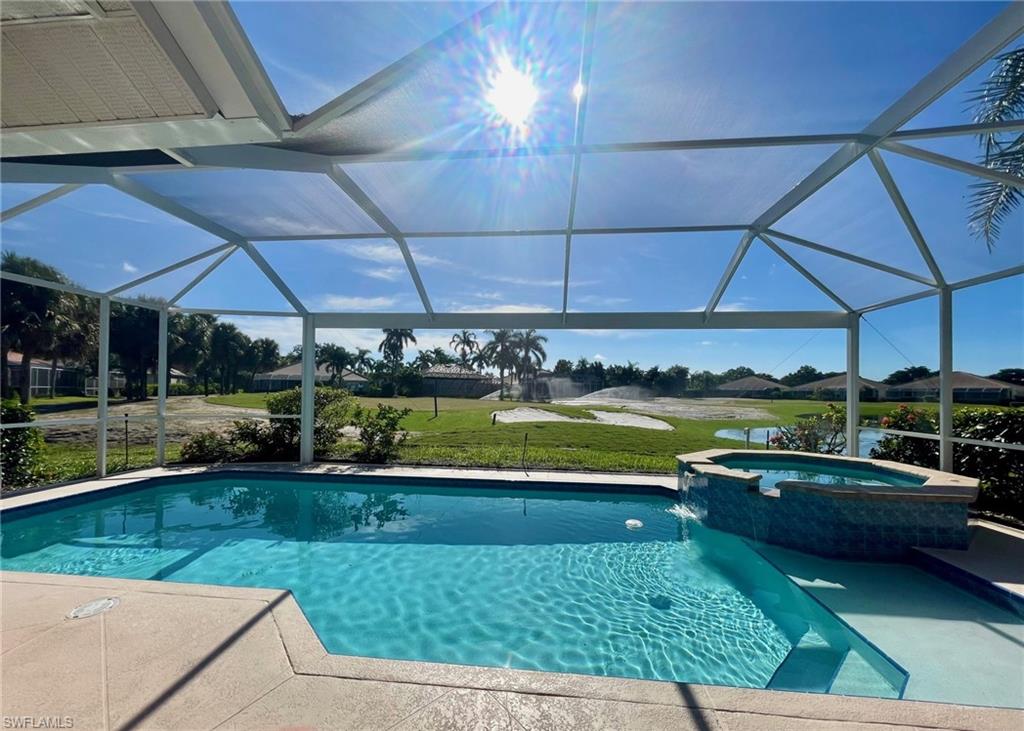 a view of swimming pool and sitting area