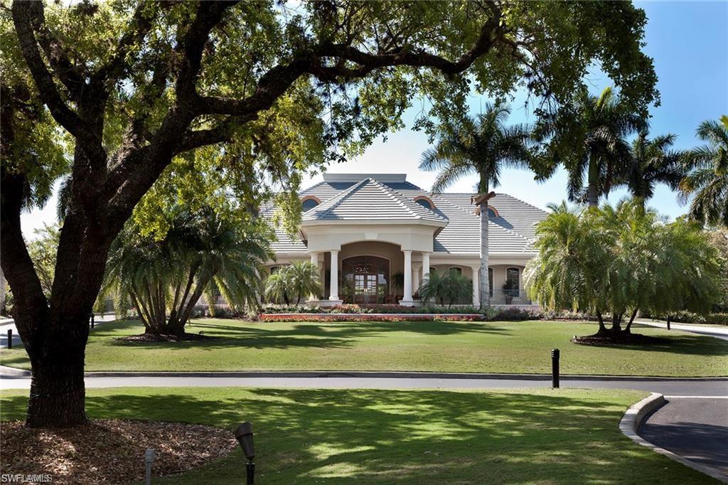 1820 Pondside Lane Naples, FL 34109 - Photo 13 of 17 a swimming pool with outdoor seating and yard