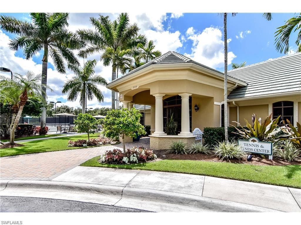 1820 Pondside Lane Naples, FL 34109 - Photo 16 of 17 a front view of house with yard and green space
