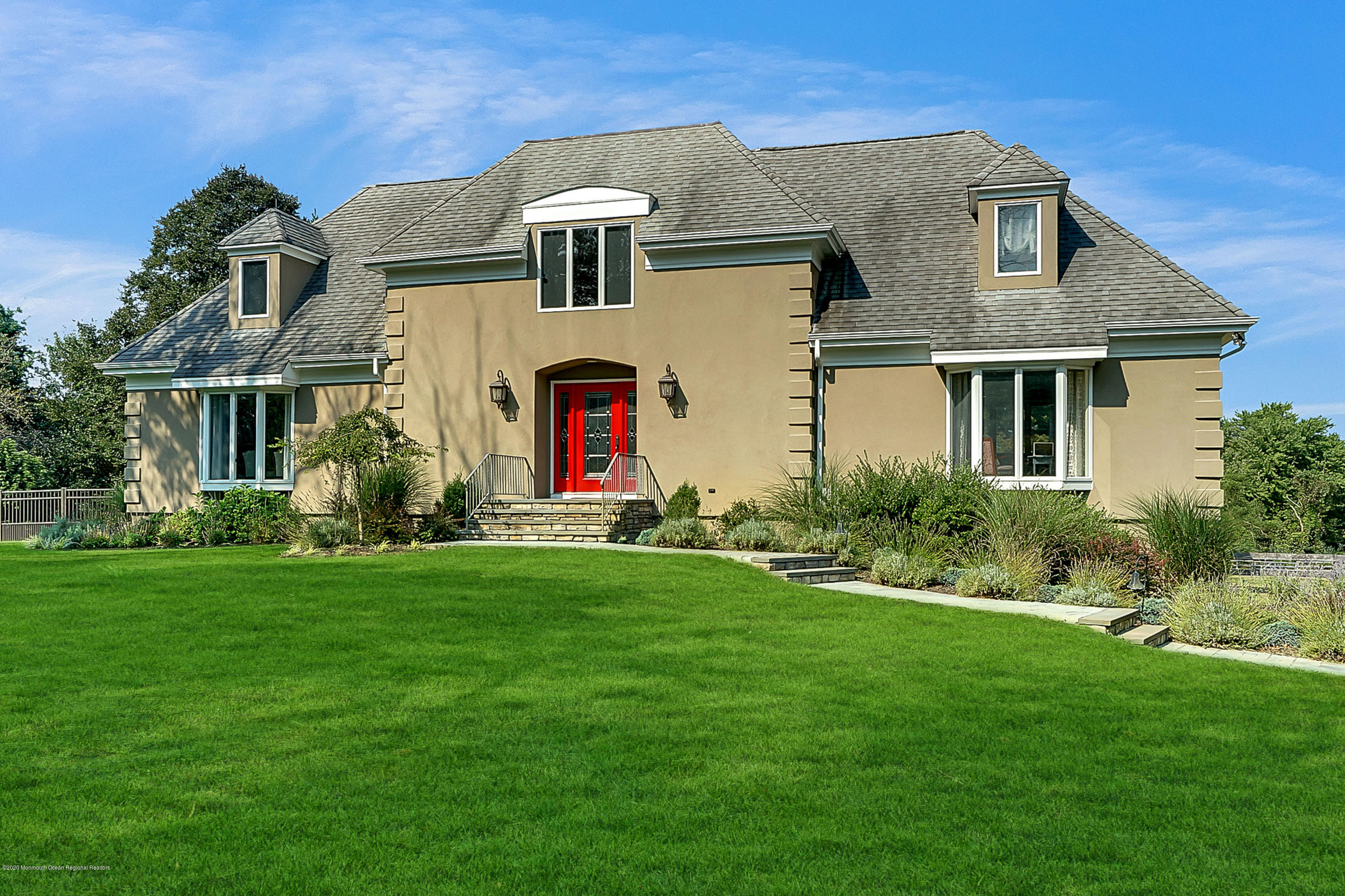 56 Hominy Hill Road Colts Neck, NJ 07722 - Photo 1 of 106 a front view of a house with a yard