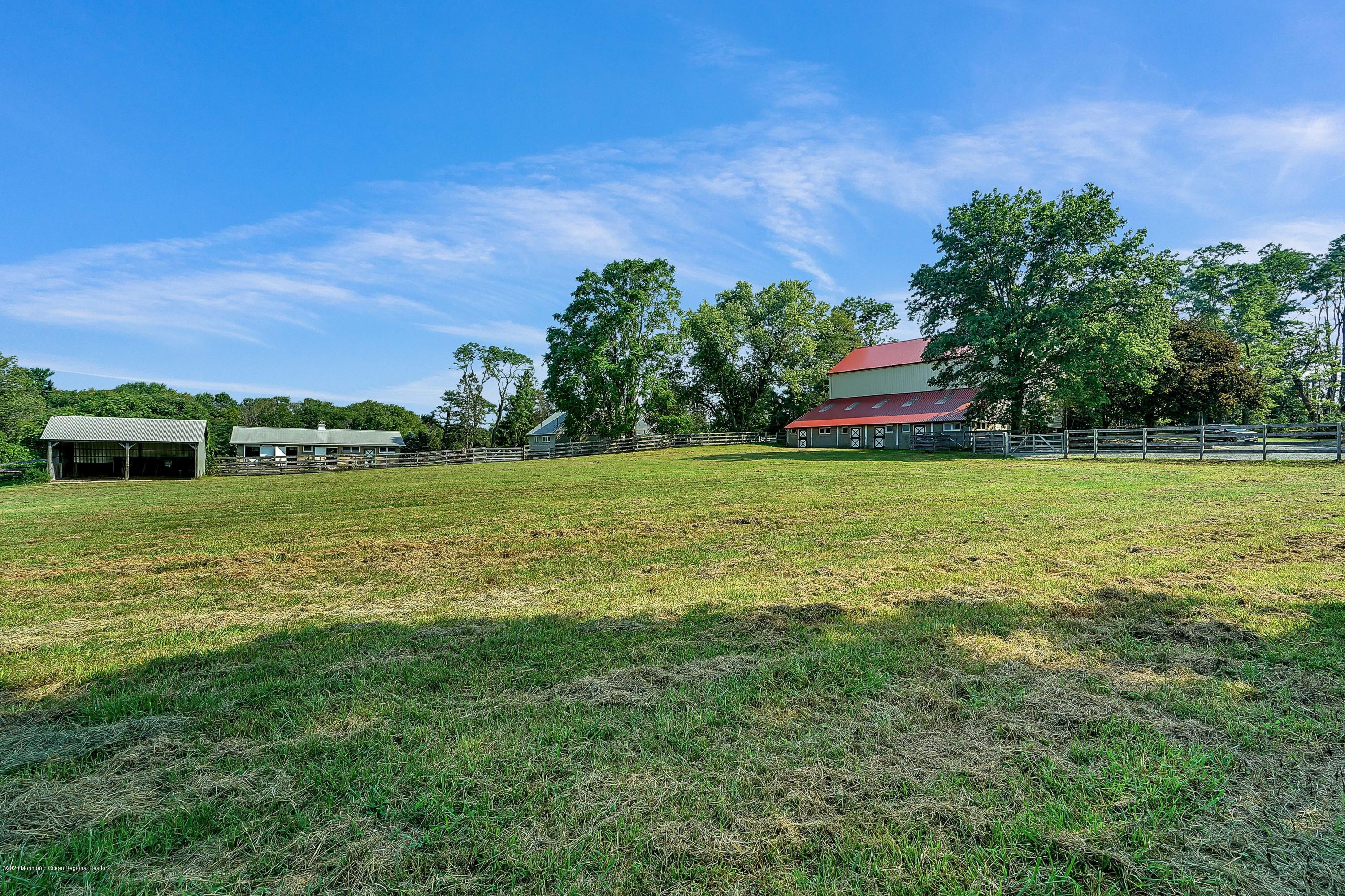 56 Hominy Hill Road Colts Neck, NJ 07722 - Photo 102 of 106 a view of a green field with house in the background