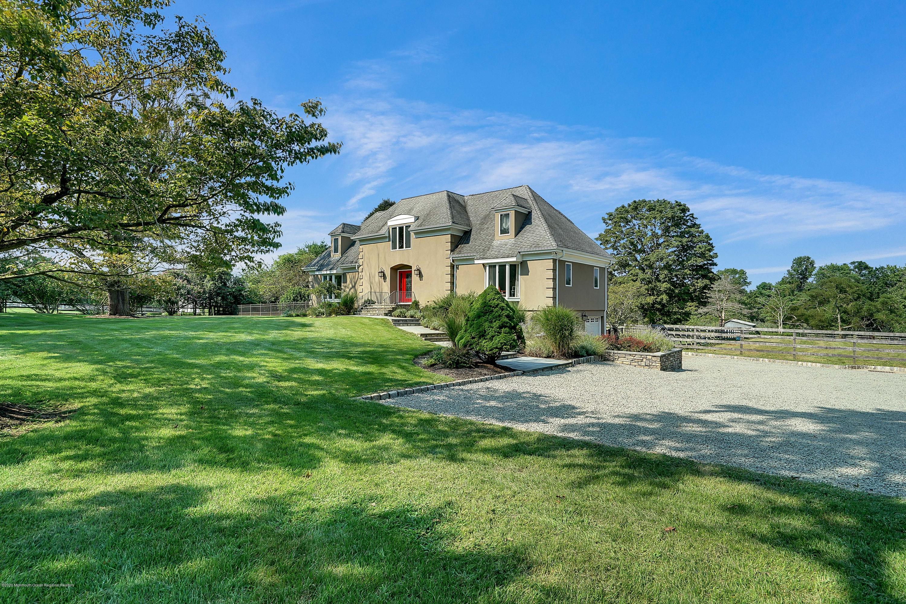 56 Hominy Hill Road Colts Neck, NJ 07722 - Photo 105 of 106 a front view of a house with garden