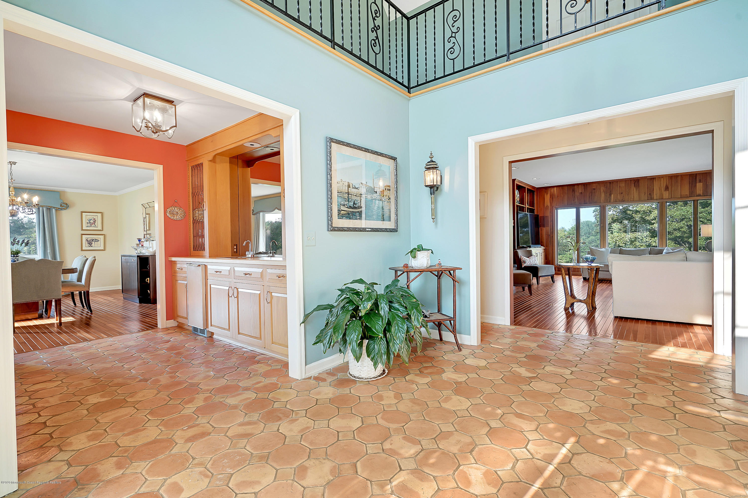56 Hominy Hill Road Colts Neck, NJ 07722 - Photo 13 of 106 a view of a hallway with a dining table and chairs