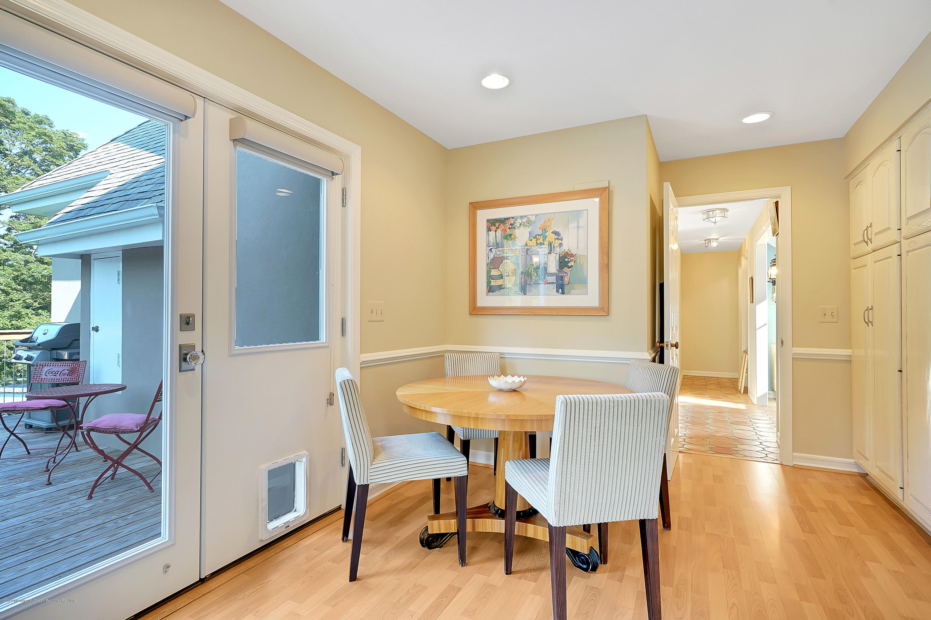 56 Hominy Hill Road Colts Neck, NJ 07722 - Photo 27 of 106 a view of a dining room with furniture and wooden floor