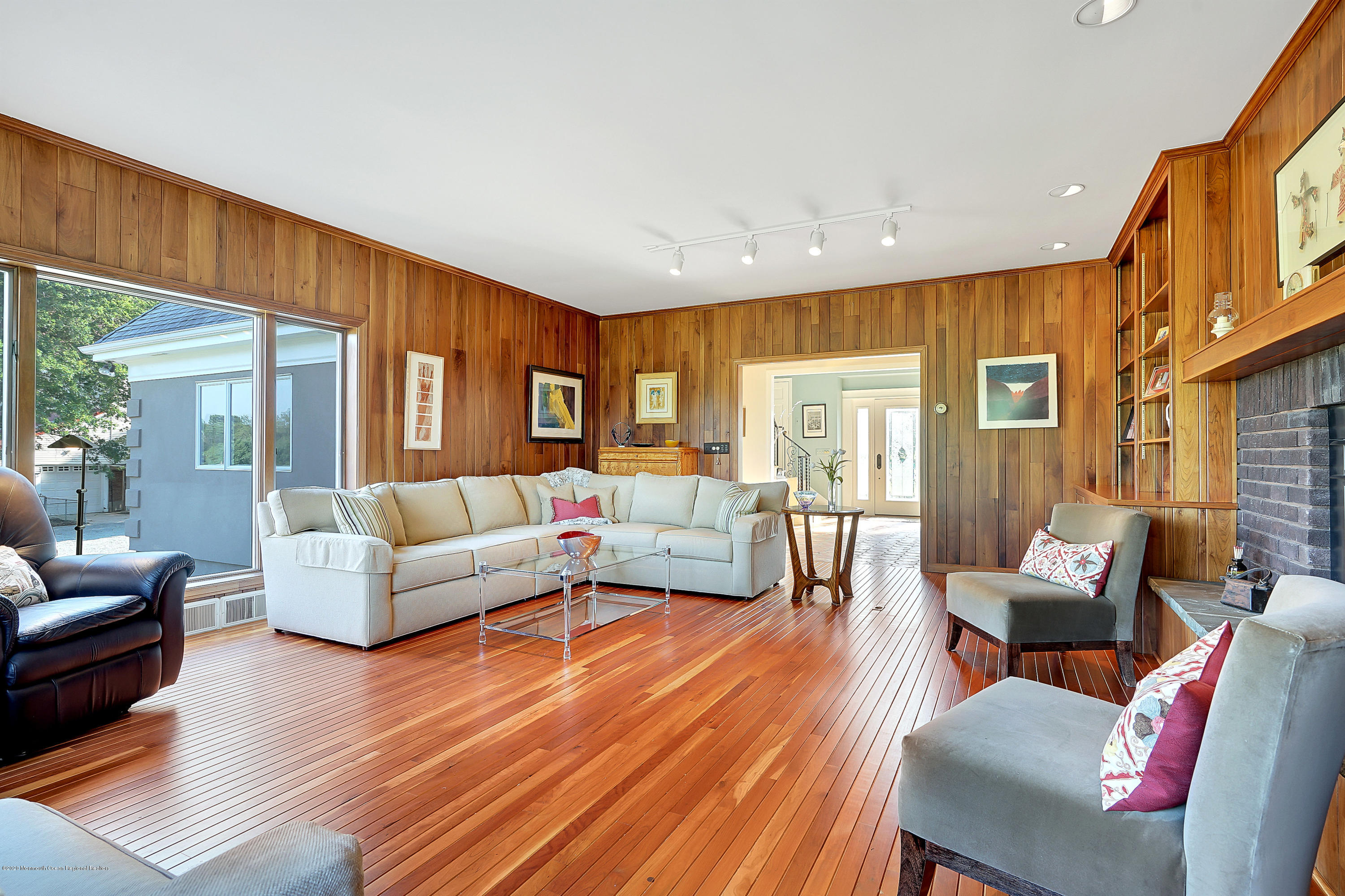 56 Hominy Hill Road Colts Neck, NJ 07722 - Photo 29 of 106 a living room with furniture wooden floor and a large window