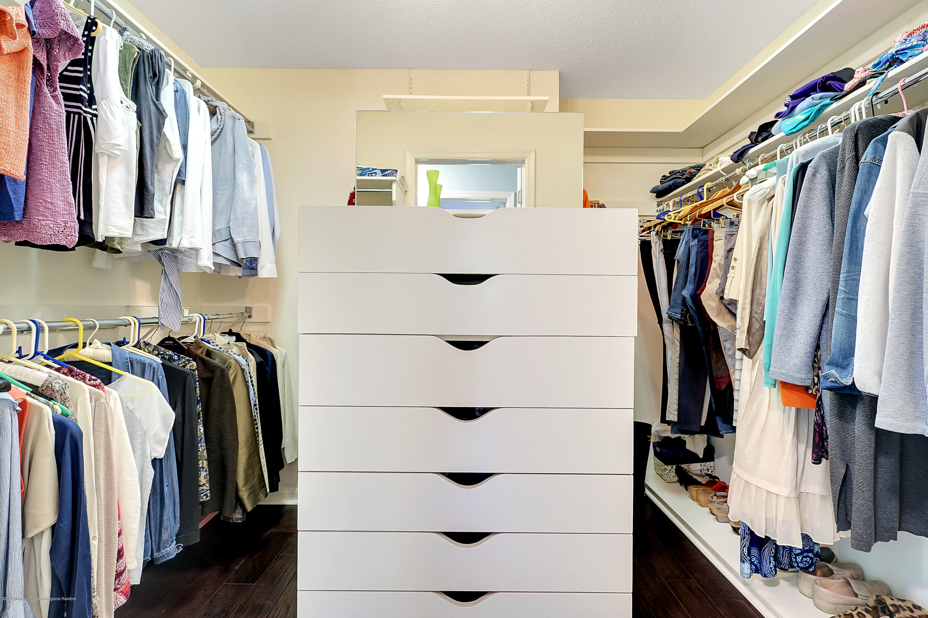 56 Hominy Hill Road Colts Neck, NJ 07722 - Photo 35 of 106 a view of walk in closet with clothes and shoes