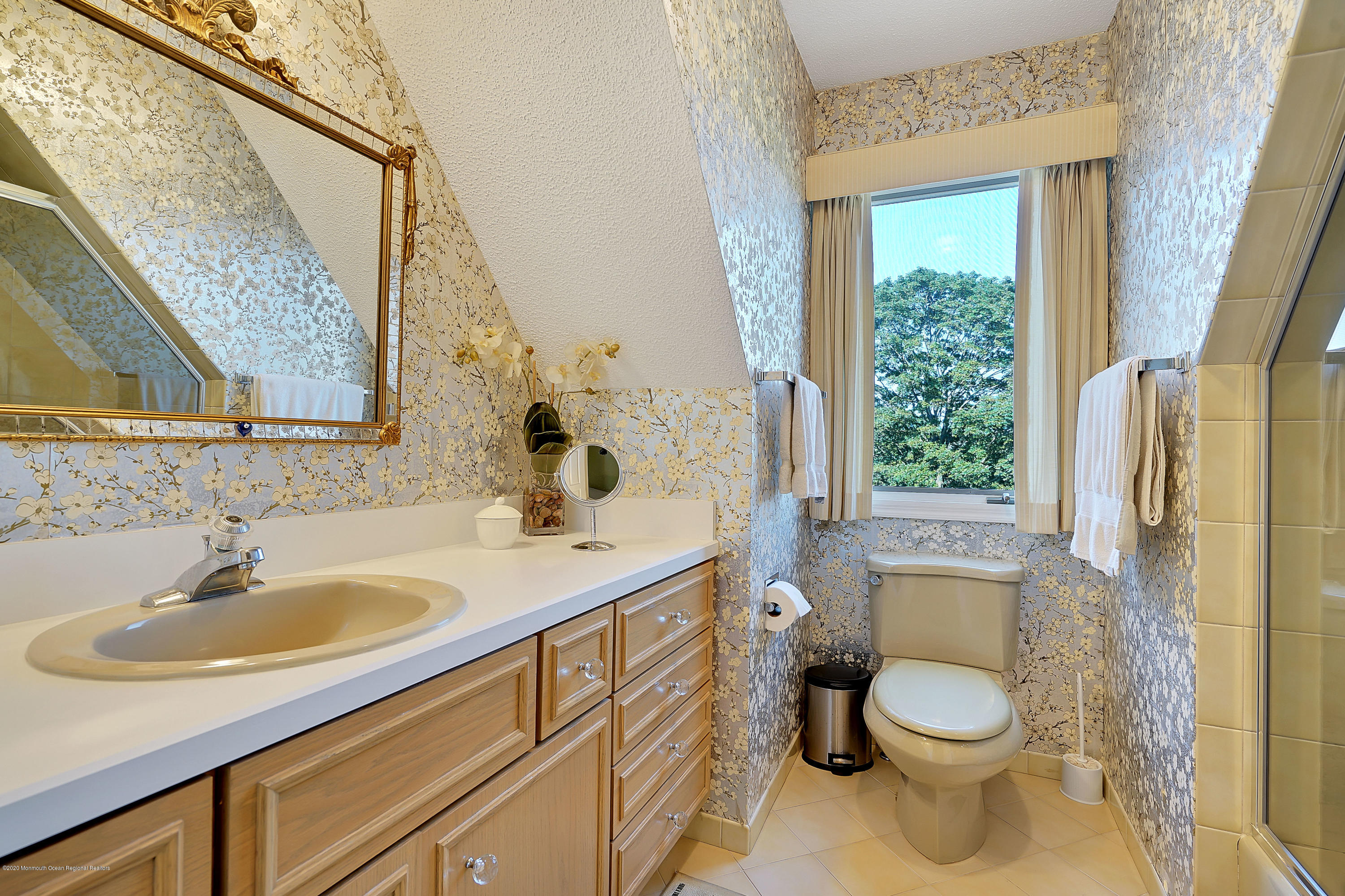 56 Hominy Hill Road Colts Neck, NJ 07722 - Photo 42 of 106 a bathroom with a sink a toilet a mirror and shower