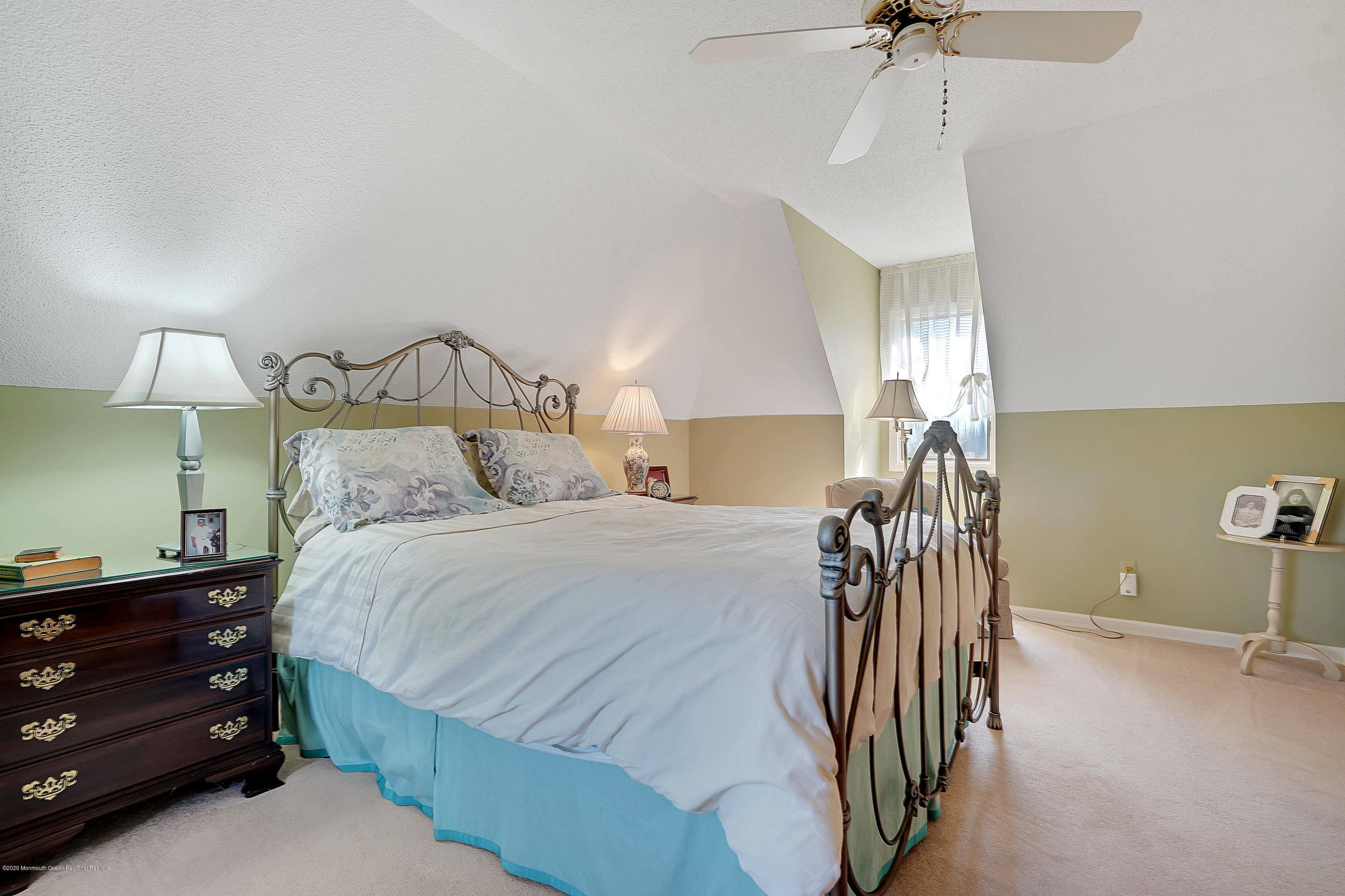 56 Hominy Hill Road Colts Neck, NJ 07722 - Photo 44 of 106 a bed room with a bed and a lamp