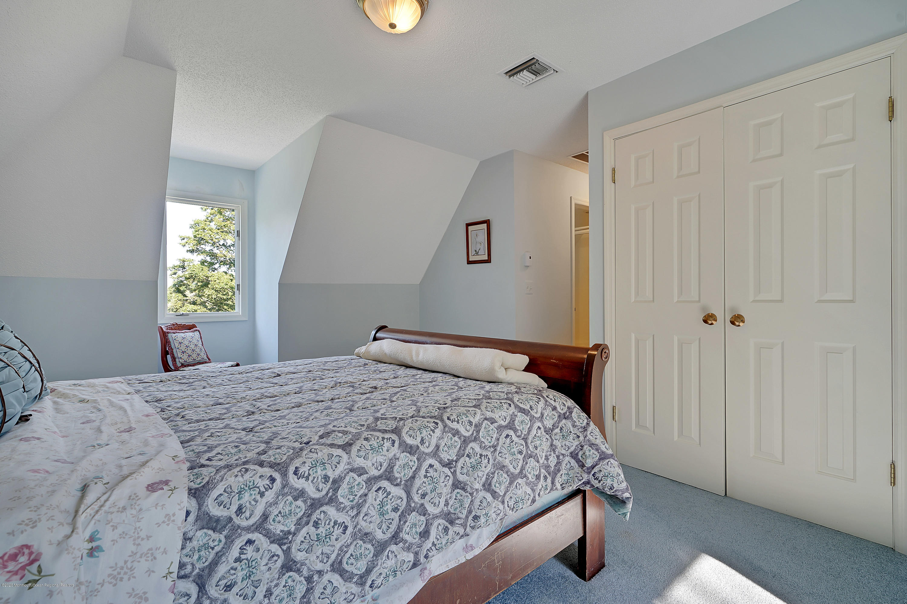 56 Hominy Hill Road Colts Neck, NJ 07722 - Photo 48 of 106 a bedroom with a bed and a window