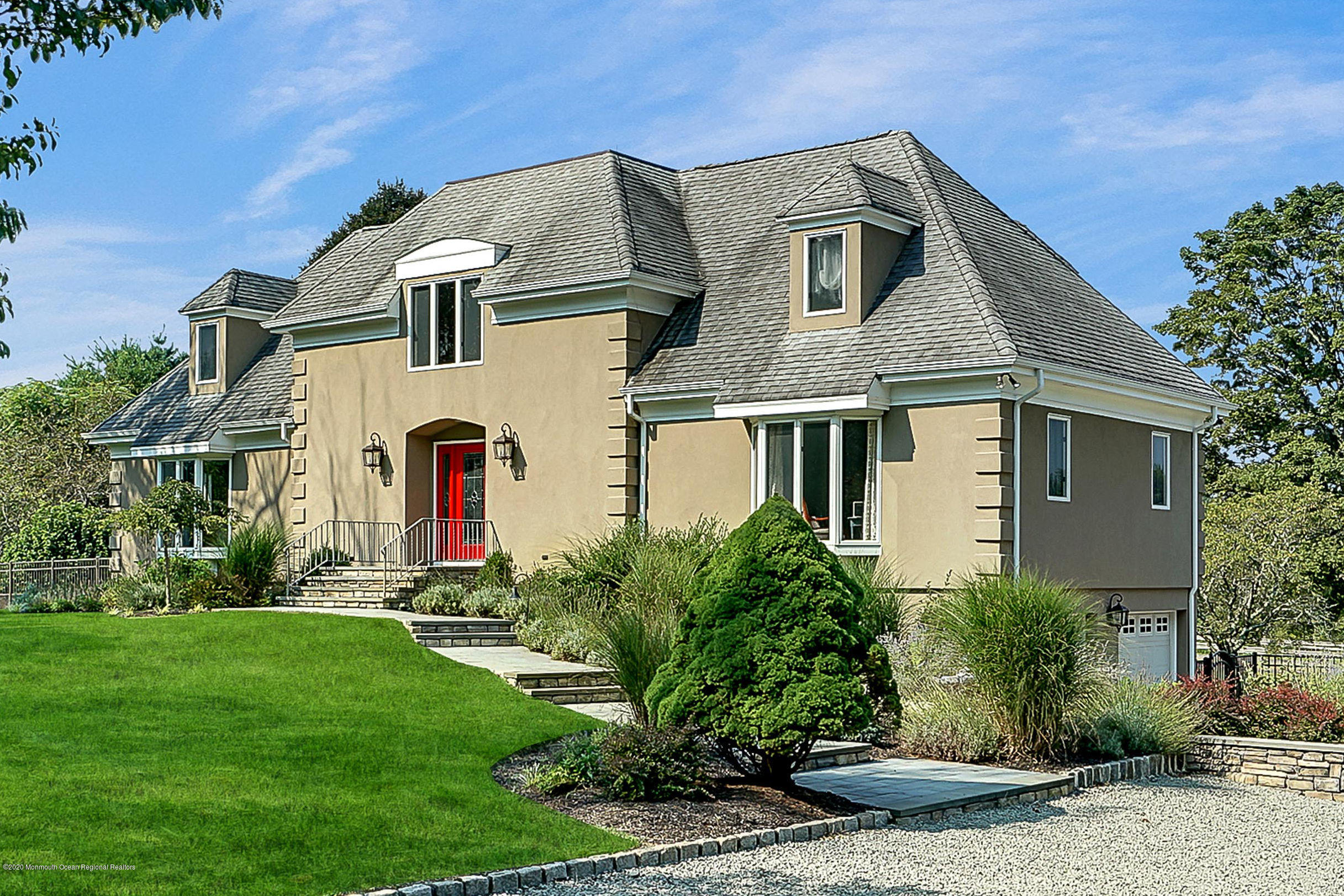 56 Hominy Hill Road Colts Neck, NJ 07722 - Photo 5 of 106 a front view of a house with a yard