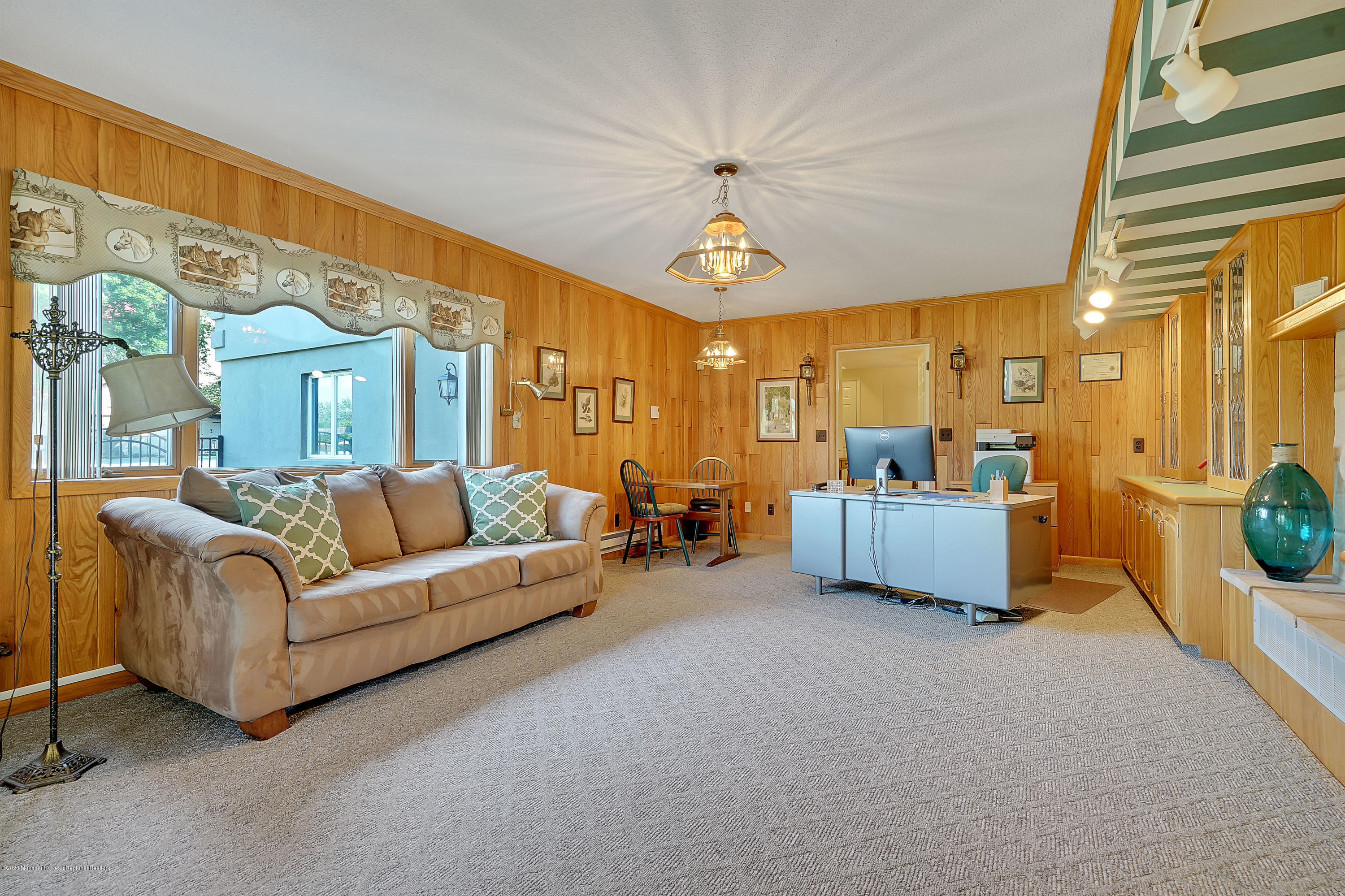 56 Hominy Hill Road Colts Neck, NJ 07722 - Photo 56 of 106 a living room with furniture and a chandelier