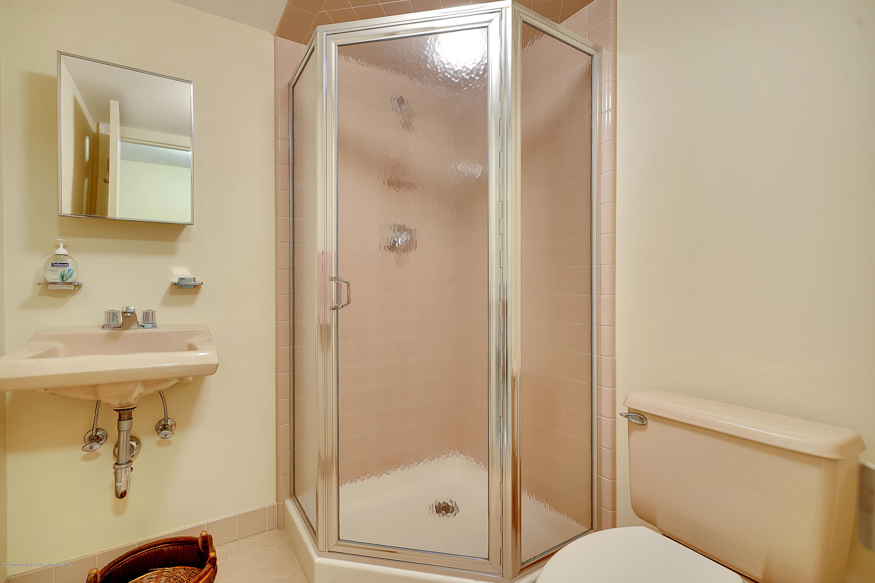 56 Hominy Hill Road Colts Neck, NJ 07722 - Photo 57 of 106 a bathroom with a shower a toilet and sink