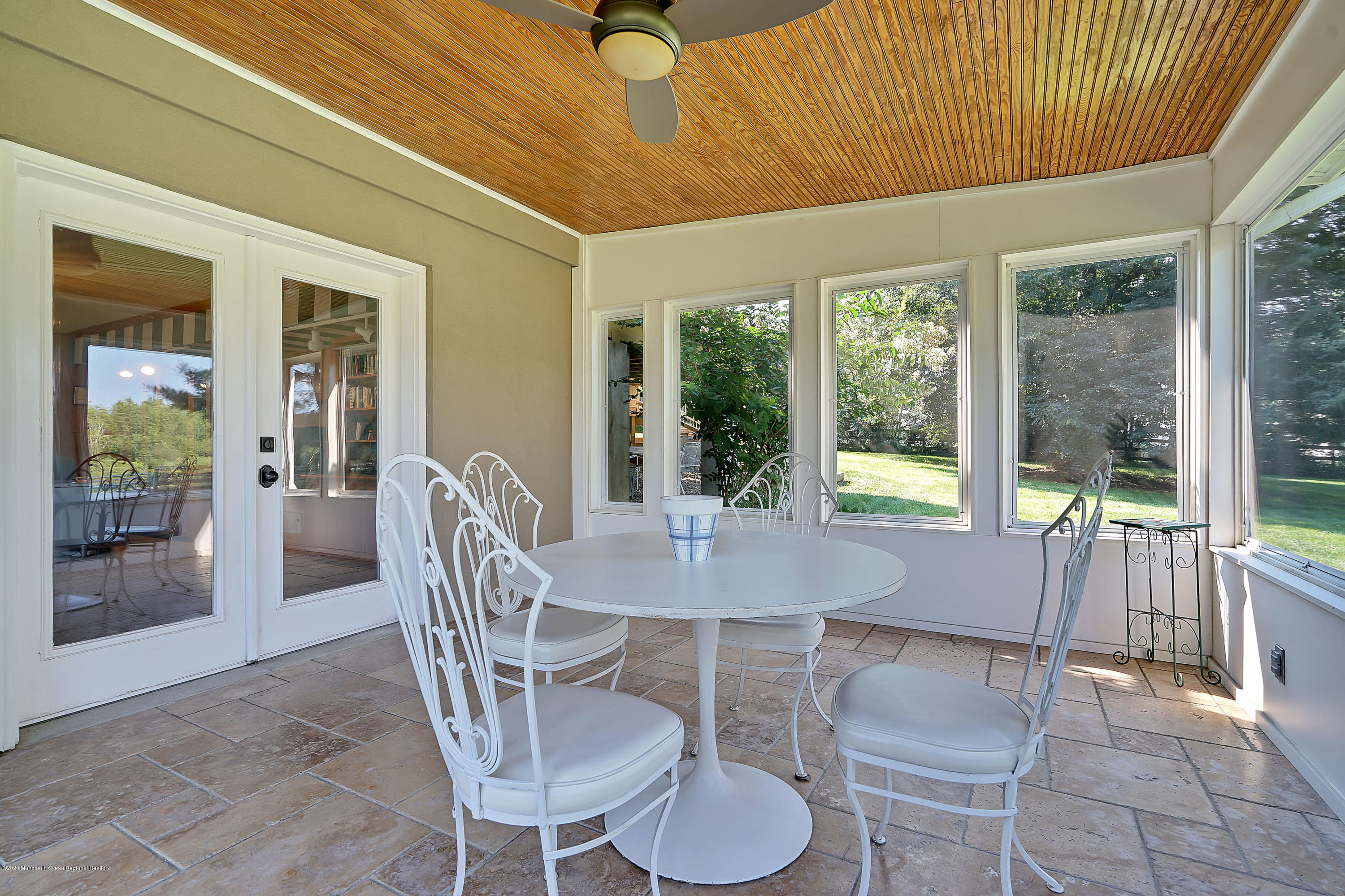 56 Hominy Hill Road Colts Neck, NJ 07722 - Photo 60 of 106 a dining room with furniture a chandelier and window