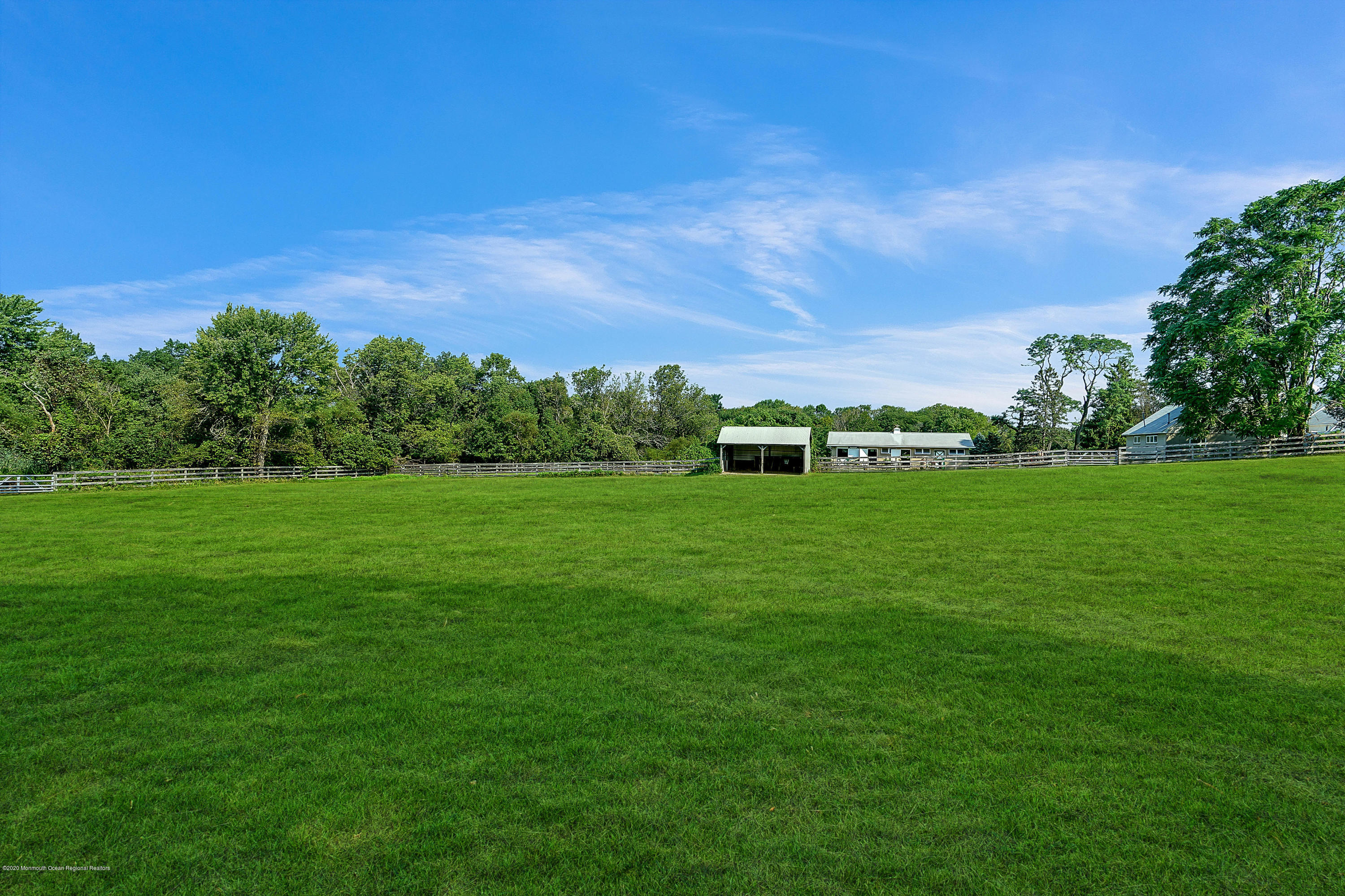 56 Hominy Hill Road Colts Neck, NJ 07722 - Photo 73 of 106 a view of a grassy field with trees