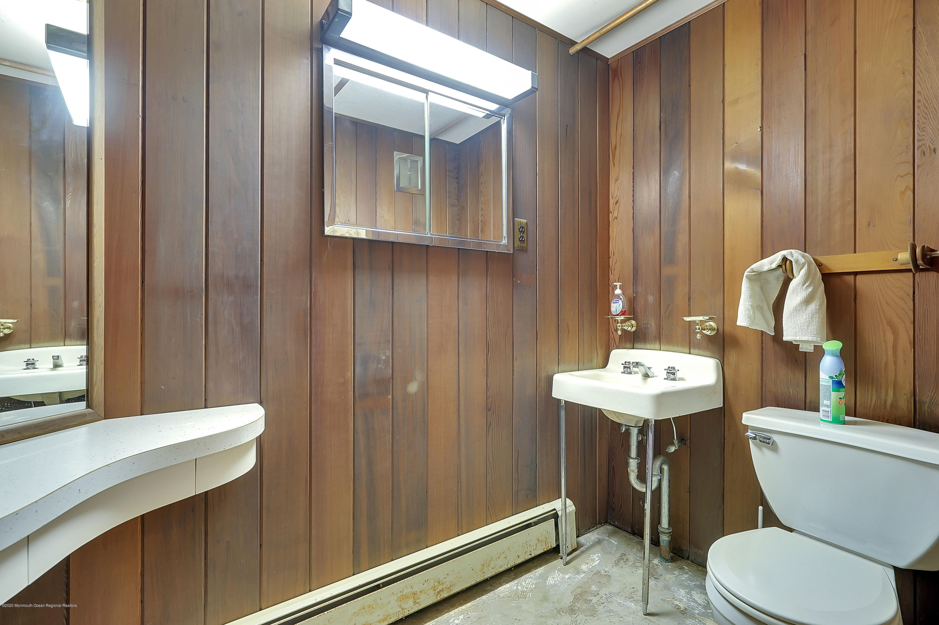 56 Hominy Hill Road Colts Neck, NJ 07722 - Photo 82 of 106 a bathroom with a toilet a sink and mirror
