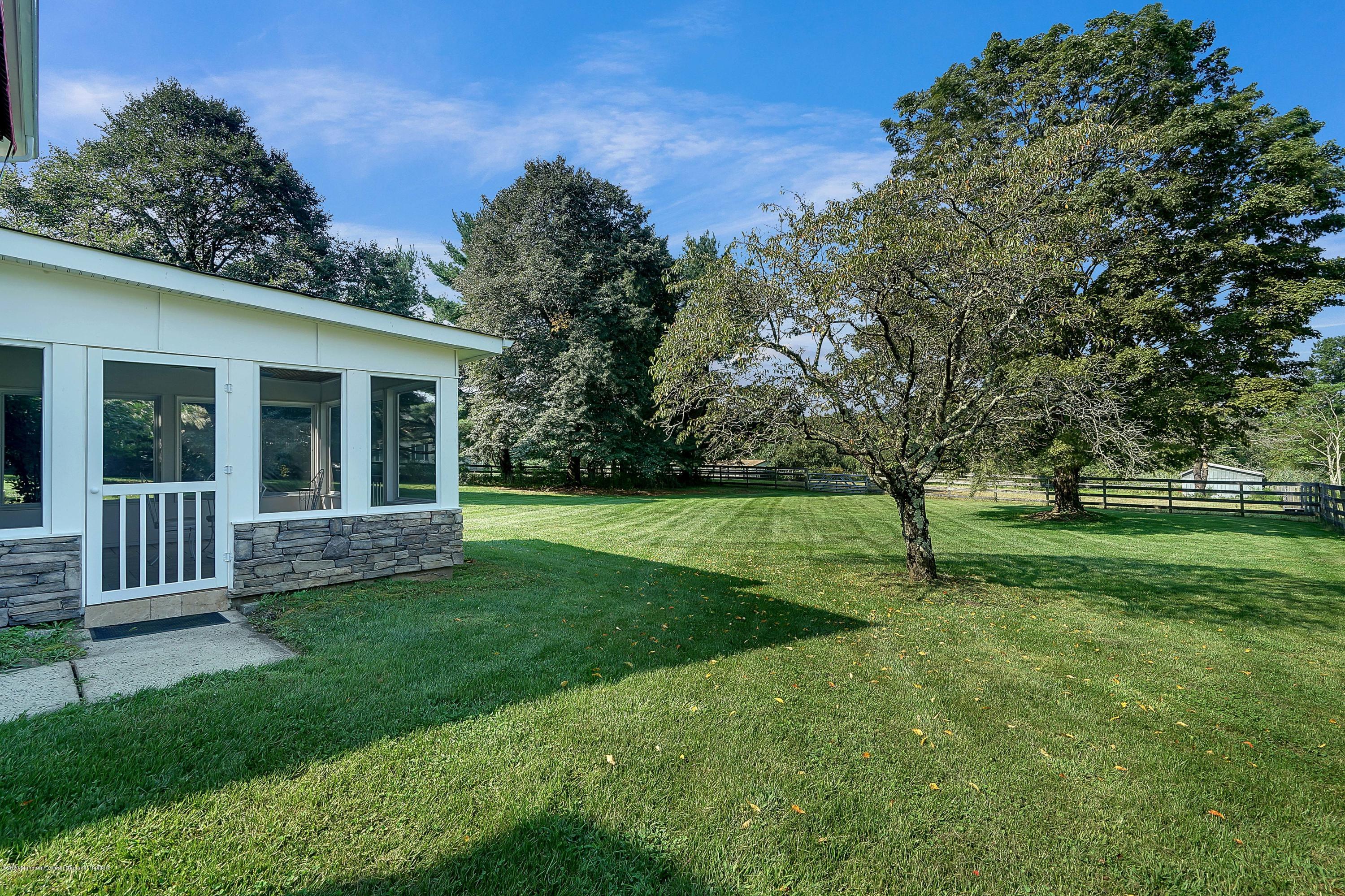 56 Hominy Hill Road Colts Neck, NJ 07722 - Photo 98 of 106 a view of a house with a backyard