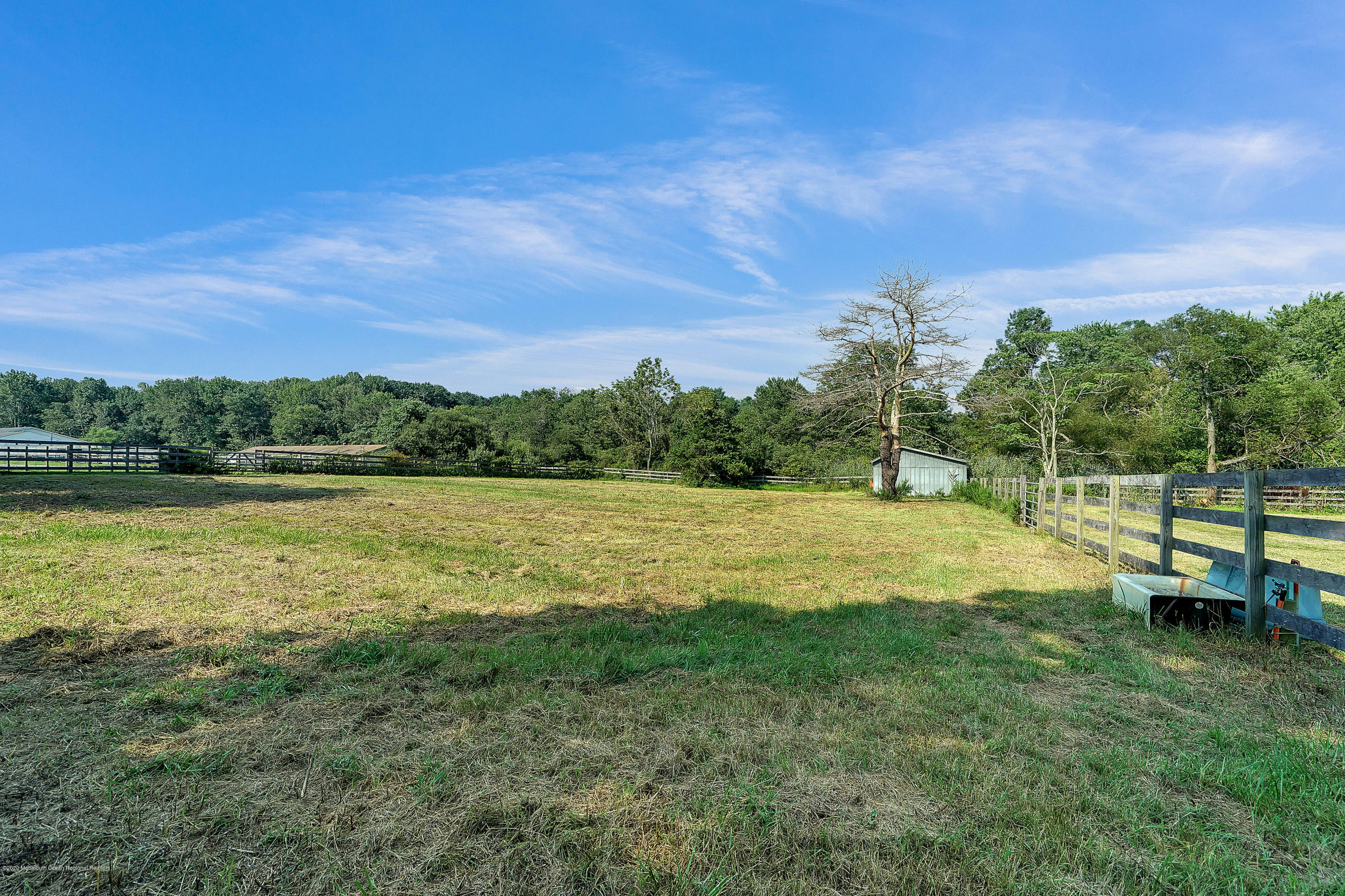 56 Hominy Hill Road Colts Neck, NJ 07722 - Photo 100 of 106 a view of a lake with houses in the back
