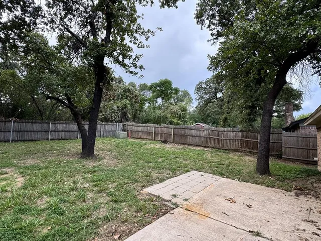 a backyard of a house with lots of green space
