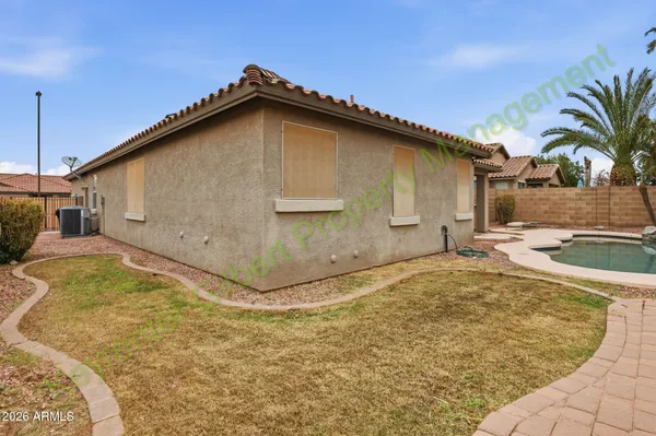 a view of a small pool with a yard