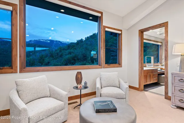 a spacious bedroom with a large bed and a couch