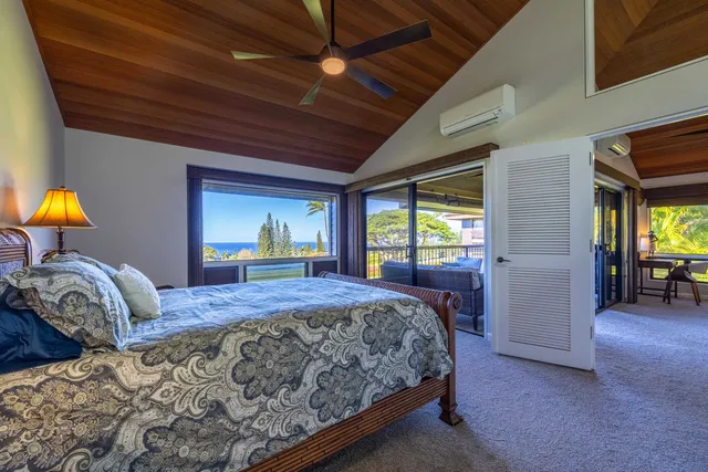 a view of a hallway with wooden floor and stairs