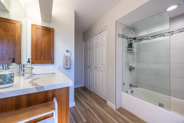 a view of a swimming pool with a table and chairs