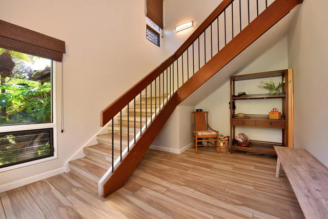 a kitchen with stainless steel appliances granite countertop a stove microwave and refrigerator