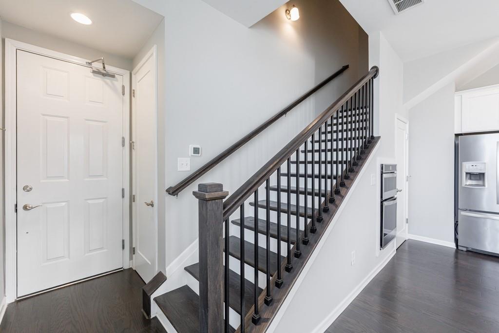 225 Britten Pass Alpharetta, GA 30009 - Photo 11 of 38 a view of an entryway with wooden floor