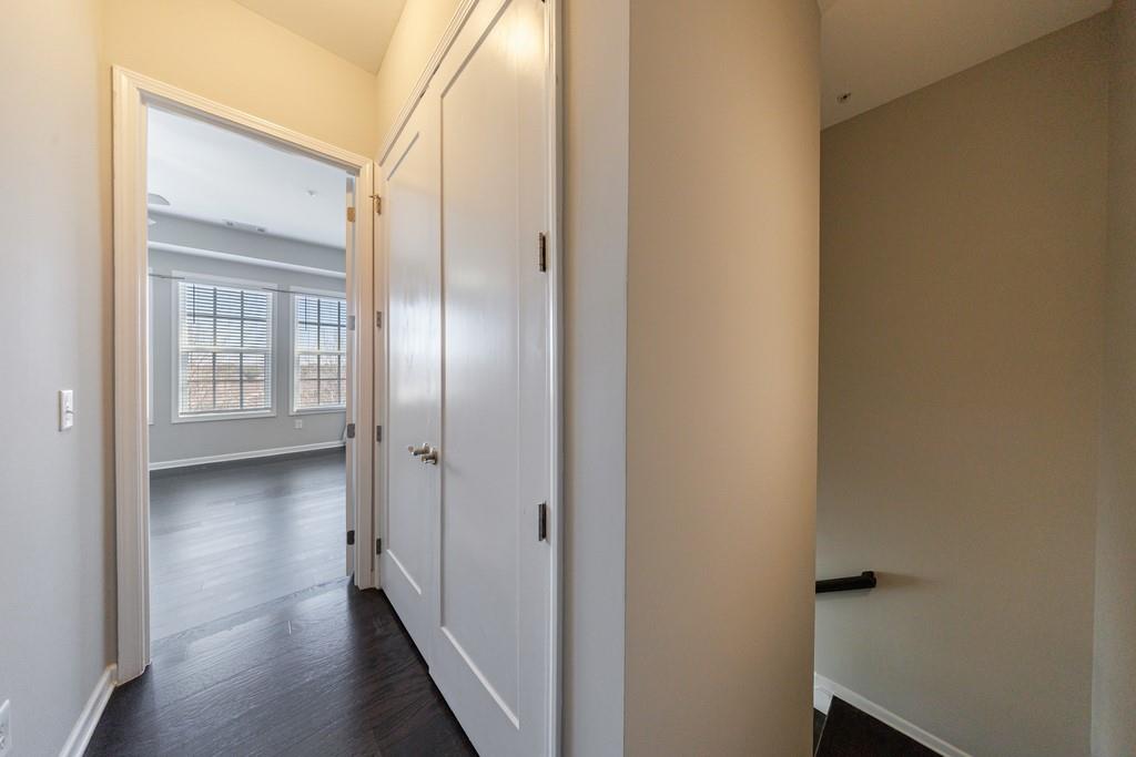 225 Britten Pass Alpharetta, GA 30009 - Photo 20 of 38 a view of a hallway with wooden floor