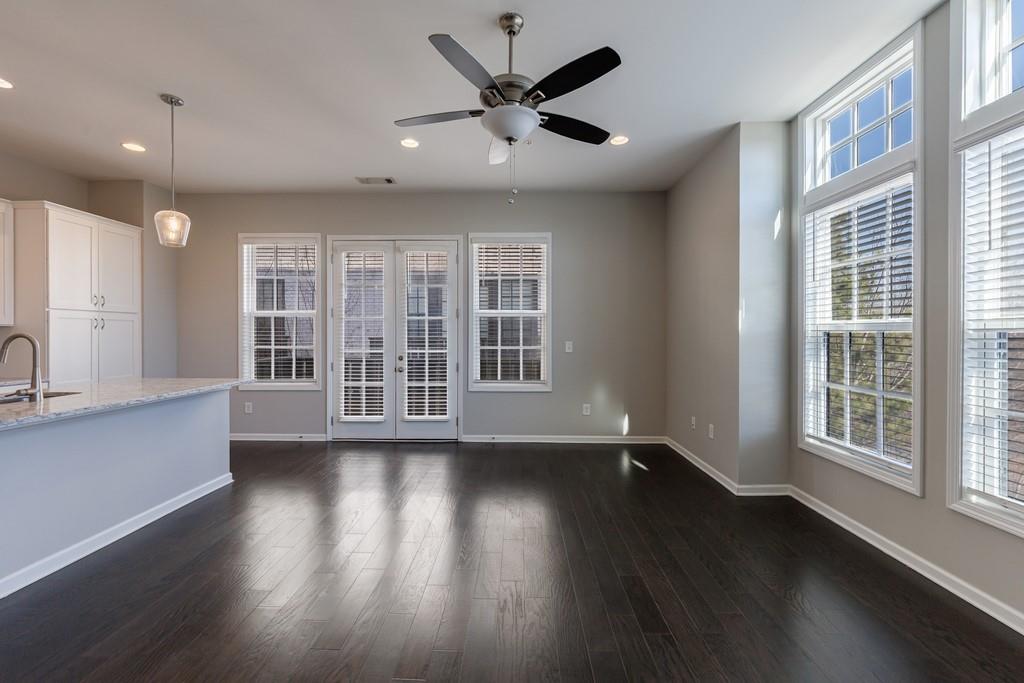 225 Britten Pass Alpharetta, GA 30009 - Photo 7 of 38 a view of an empty room with wooden floor and a window