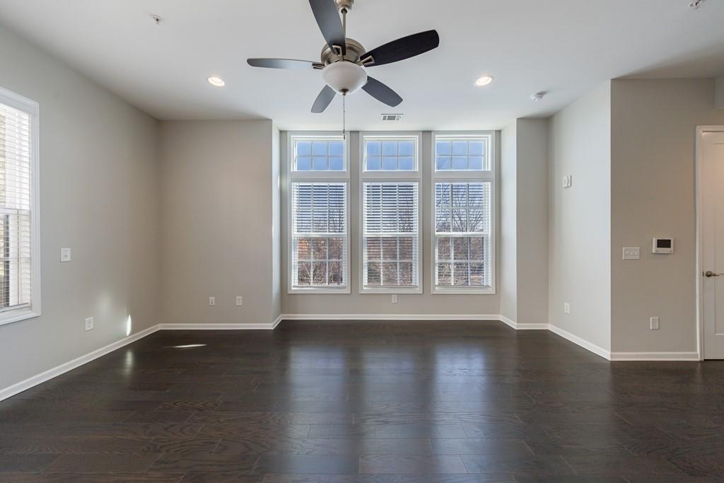 225 Britten Pass Alpharetta, GA 30009 - Photo 8 of 38 a view of an empty room with wooden floor and a window