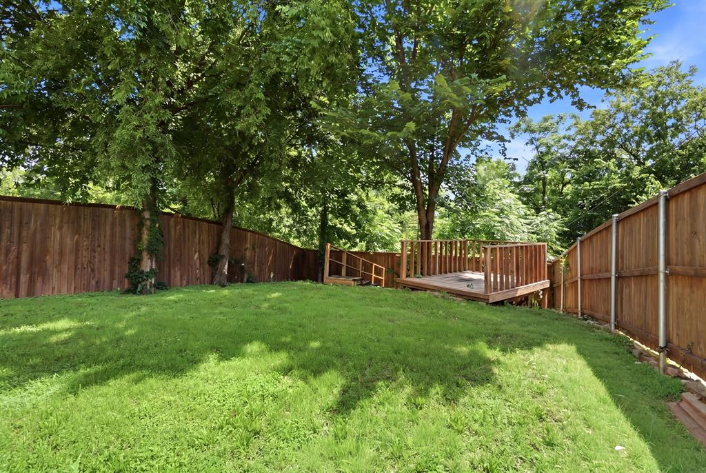 7354 Walling Lane Dallas, TX 75231 - Photo 25 of 28 a view of a backyard with a small cabin