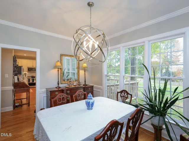 a kitchen with stainless steel appliances granite countertop a sink a stove a microwave and cabinets