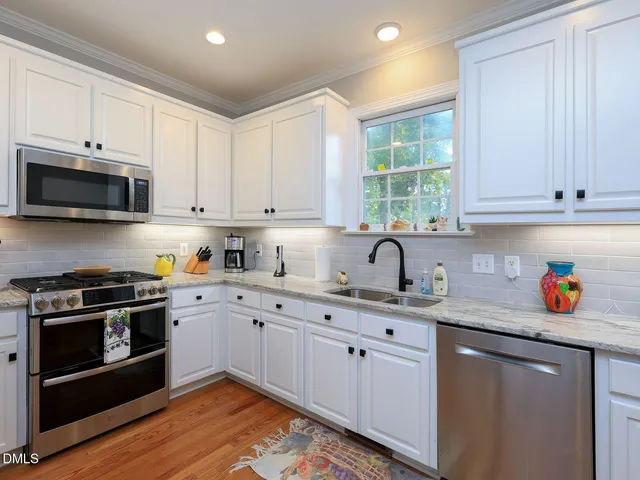 a bathroom with a sink mirror and a shower